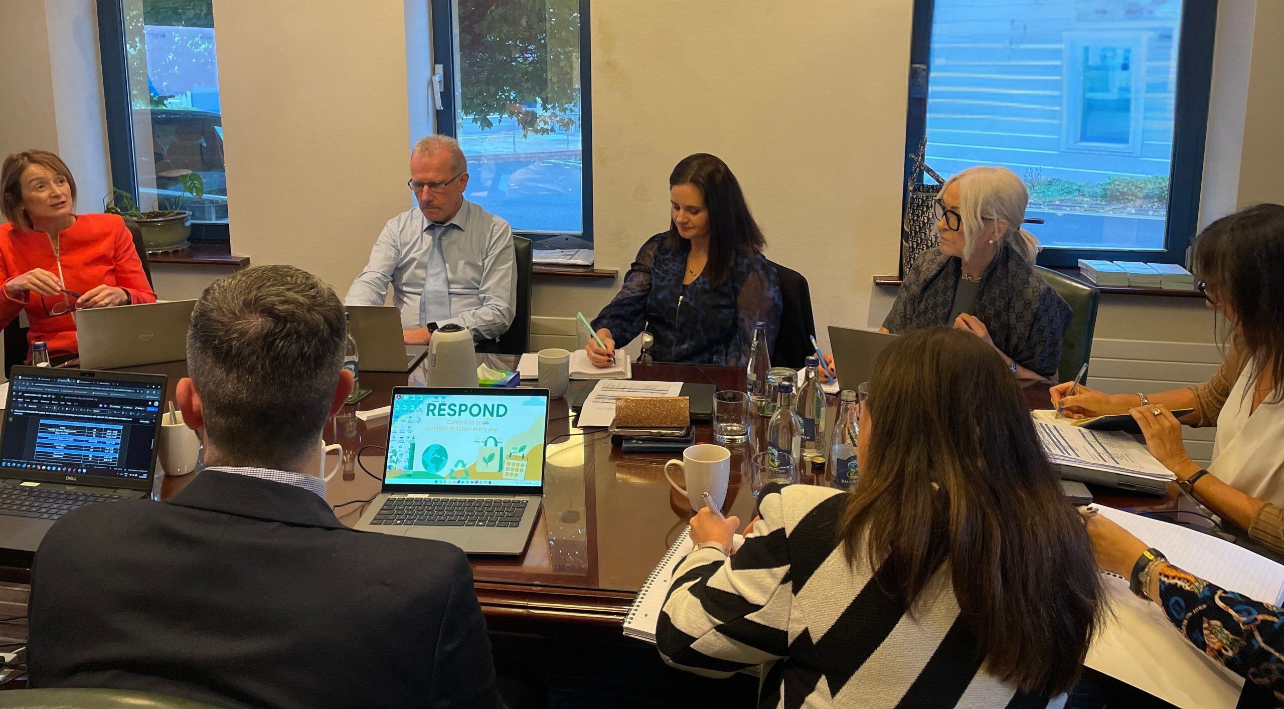 Colleagues working together in meeting room